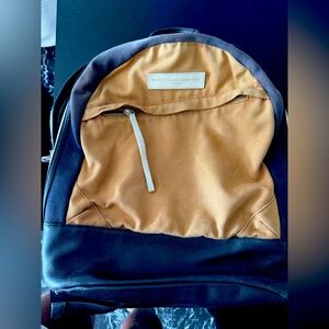 Worn Want Les Esentials leather & canvas backpack w classic gold and silver zip